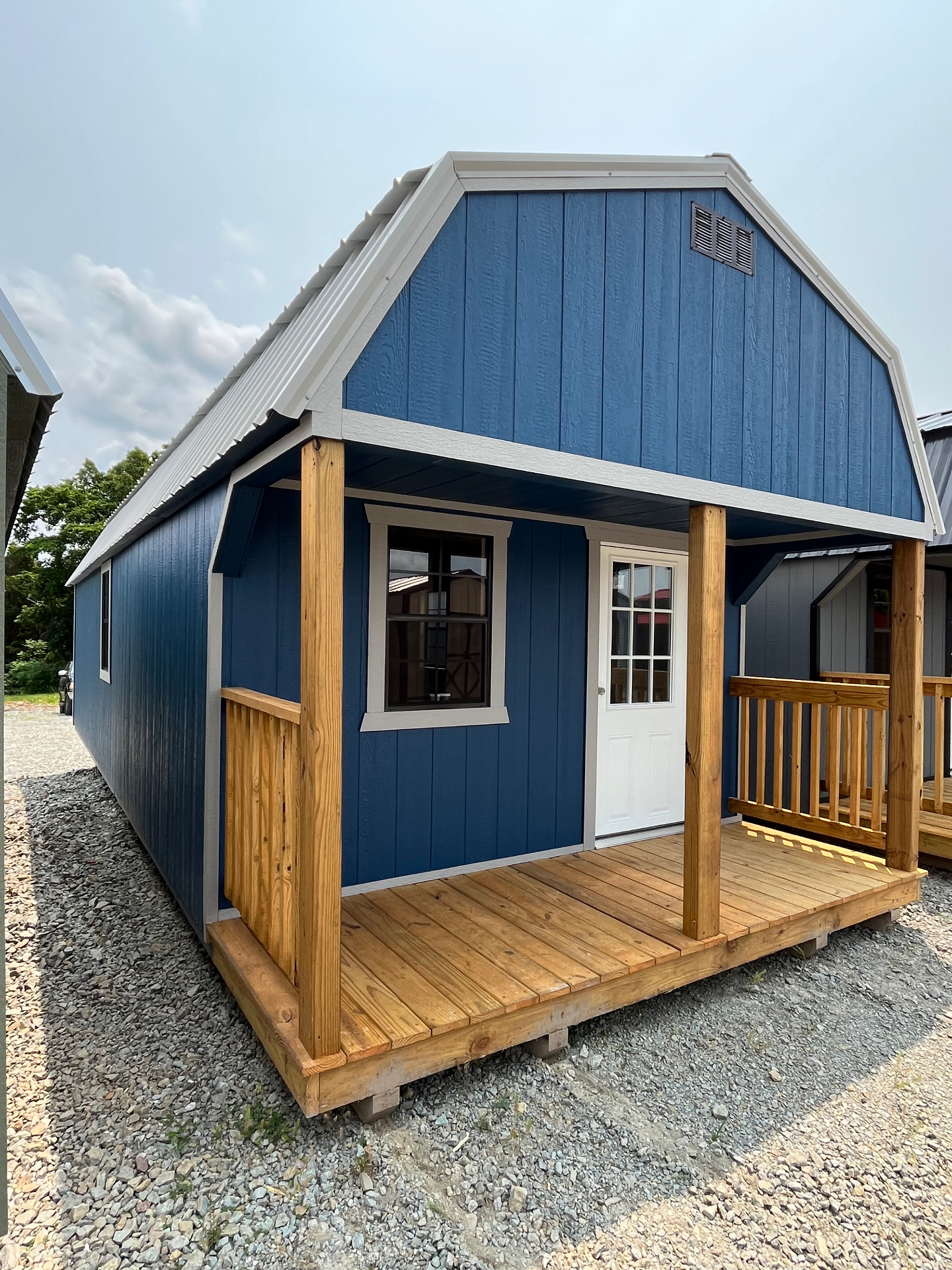 Lofted Cabin - Blue exterior with porch